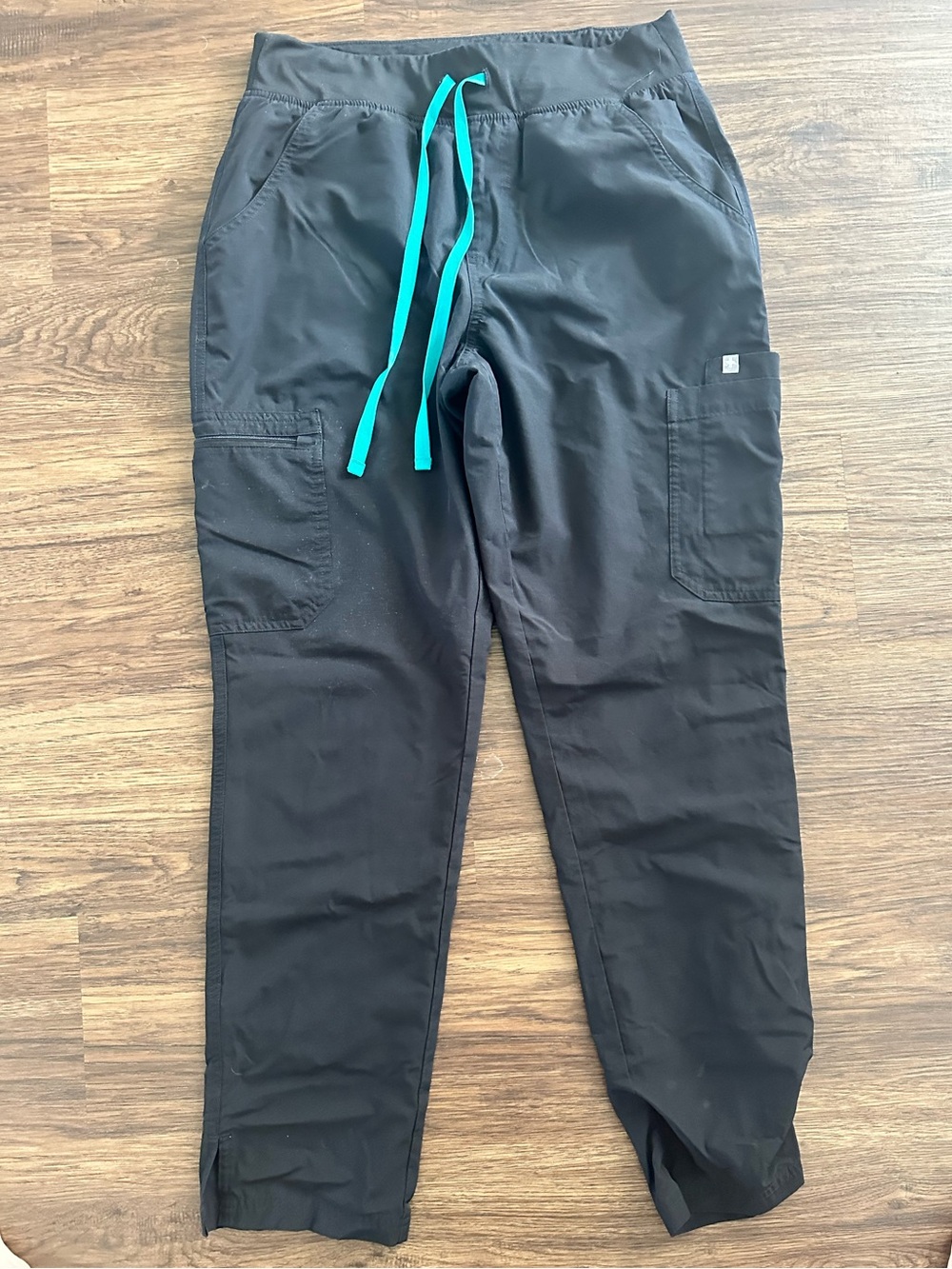 Black and teal scrub pants